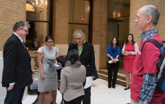 Senate President Karen Spilka talking to Steve Higgins (IA) and Jennifer Lee (STAVROS and MASILC)