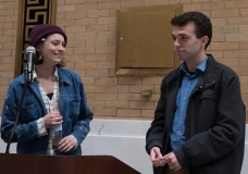 Two young people at podium