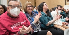 Meg Coffin applauding in the crowd