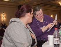 two women talk over schedule