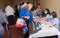 Woman visits My Ombudsman table