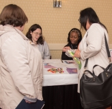 Women speaking at table