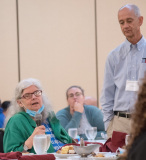 Bill (BCIL) hands microphone to questioner