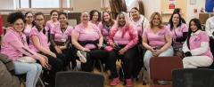 Large group of women in pink from NILP indoors