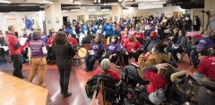 Becca Gutman rallies the crowd. , indoors.