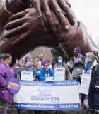 MA Senior Action Council members behind large sign under Embrace