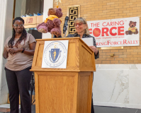 Interpreter (l), Senate President Karen Spilka