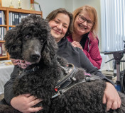 Two woman and support dog