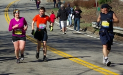 Young man running with guide