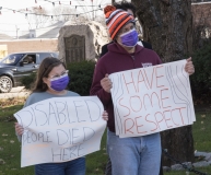 Man and daughter: "Disabled People Died Here", "Have Some Respect"