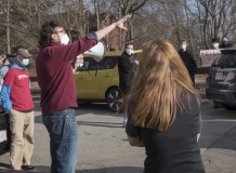 Alex Green speaks to protesters at Fernald.