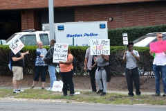 Sign Holders along the street in front of Boston Globe