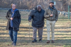 three advocates enter the cemetery