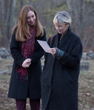 Maura Sullivan and Secretary Marylou Sudders reading memorial card for John Scott