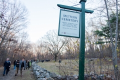 MetFern Cemetery sign and advocates leaving cemetery
