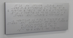 The braille translation of the plaque