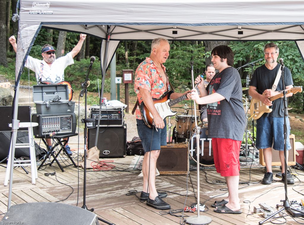 Attendee sings along with Attik Band