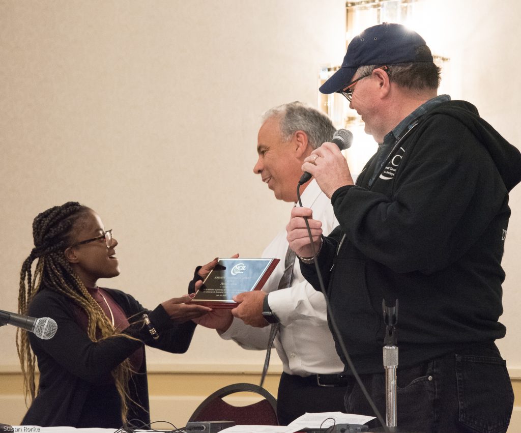 Jennifer Lee and Steve Higgins give David the award.