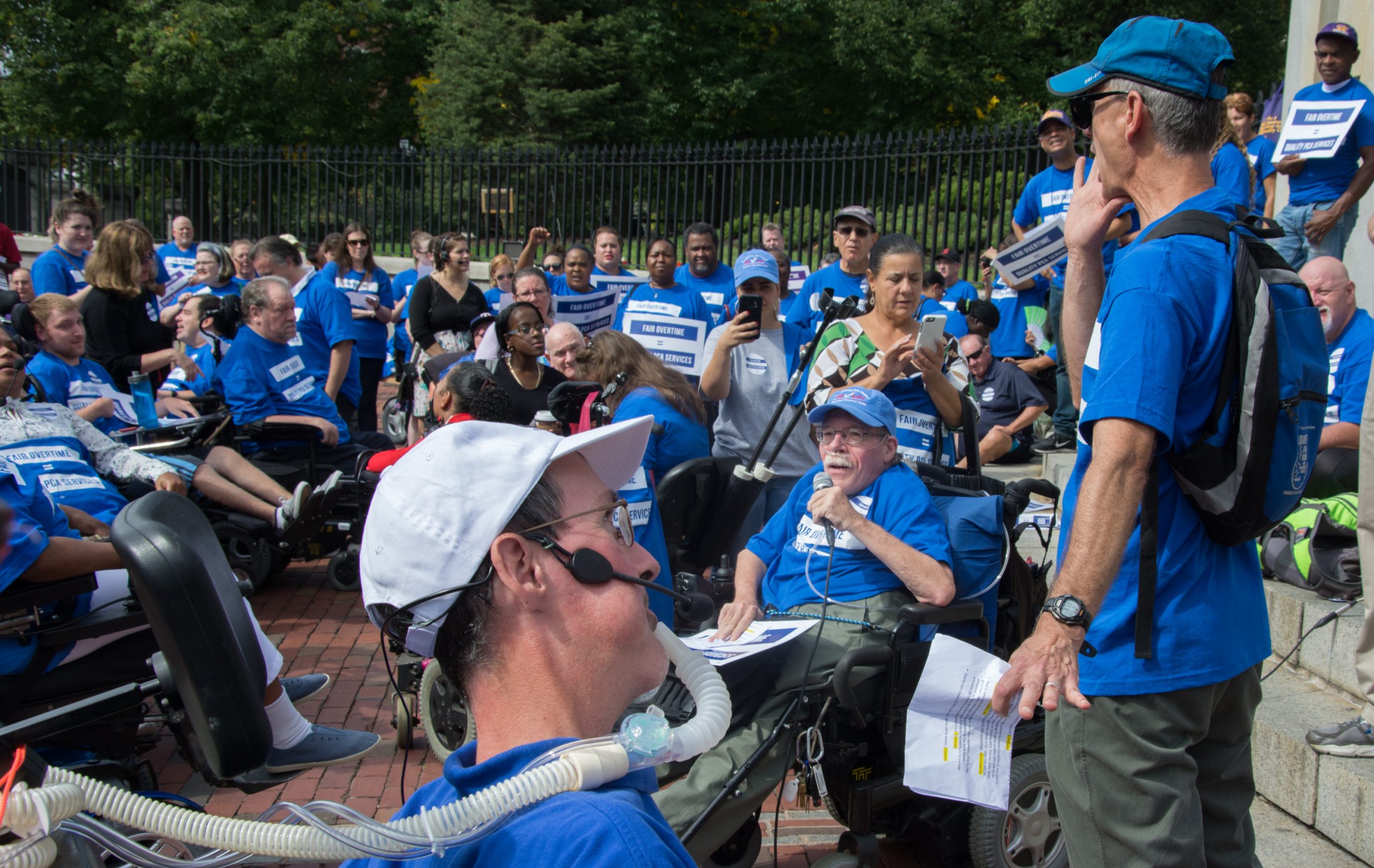 Paul speaking at 2016 PCA Overtime wages rally in Boston
