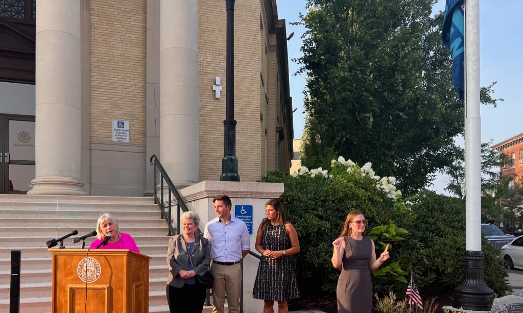 State Rep Denise Garlick, State Rep Kate Donahue, State Rep Jack Lewis, State Rep Priscila Sousa and ASL Interpreter