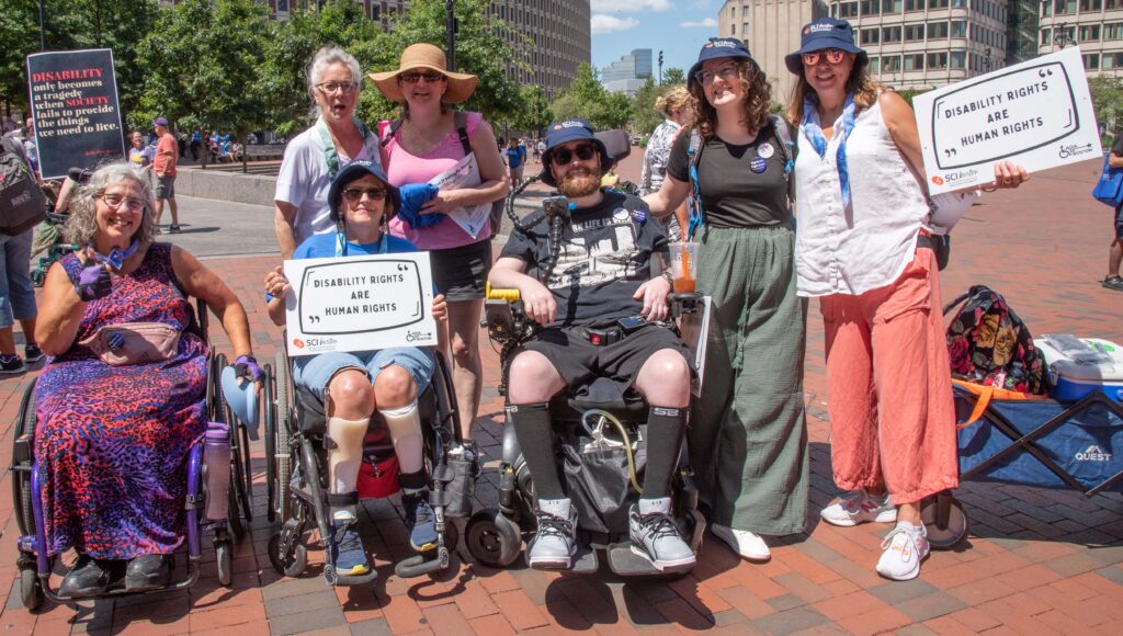 Activists with signs "Disability Rights are Human Rights"
