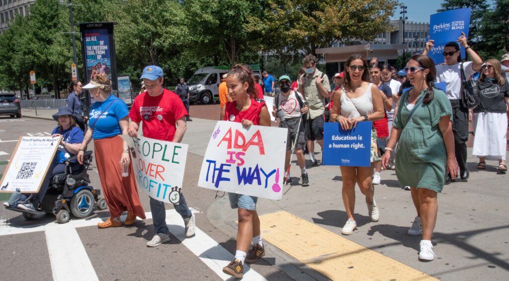 Marchers: ADA is the Way, People over Profit, Education is a Human Right