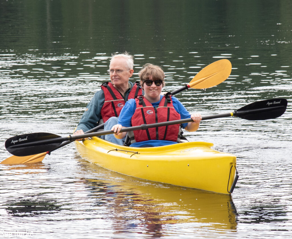 Man and daughter kayaking