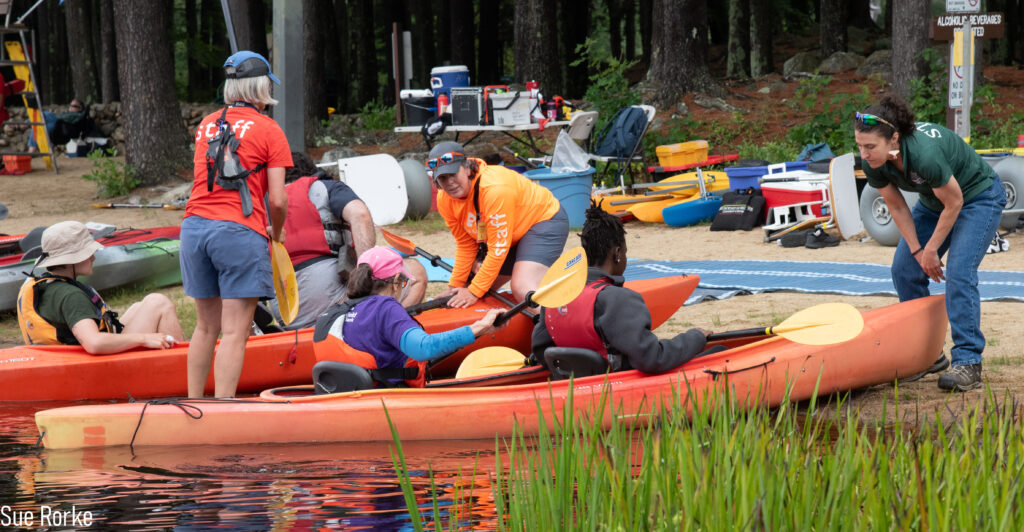 People getting into kayaks