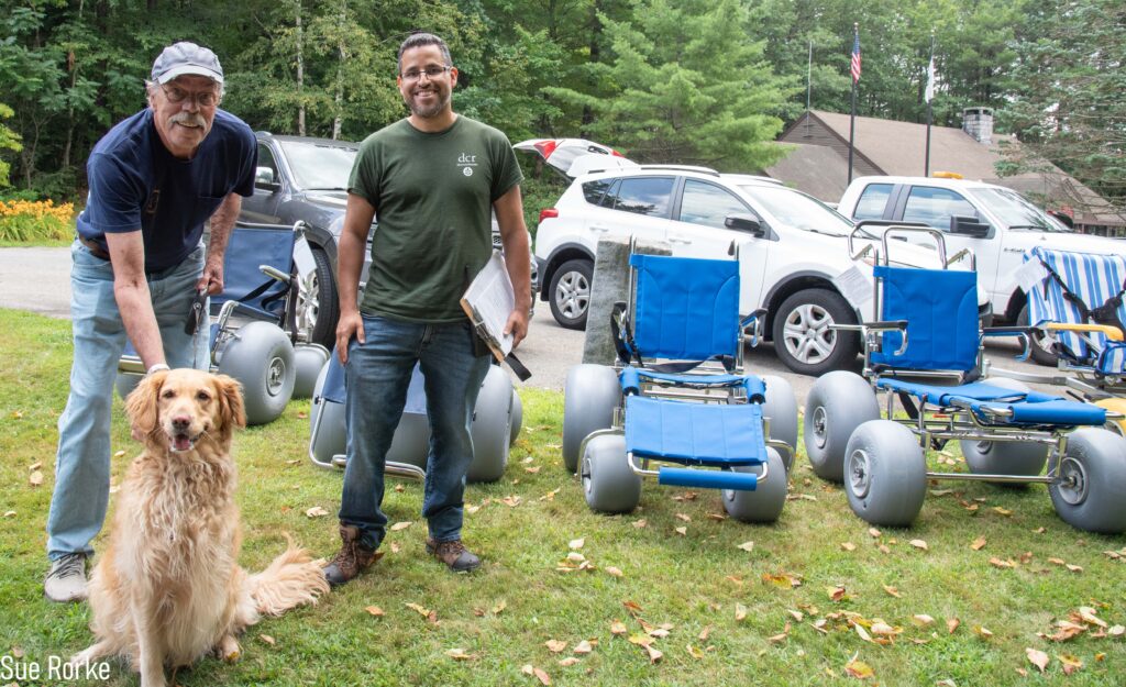 DCR staff and man with 3 legged dog