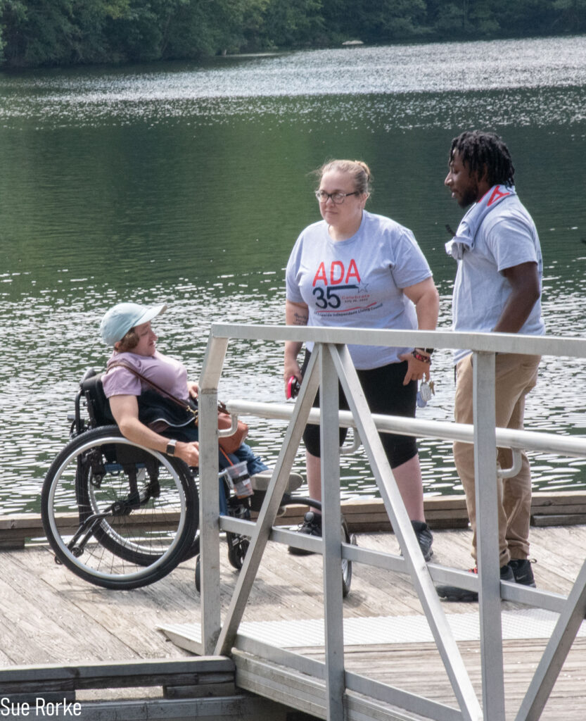 Desi, Patrick and another woman on the dock