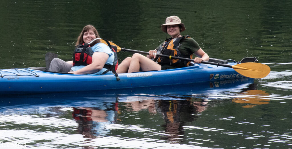 Guide and attendee kayaking