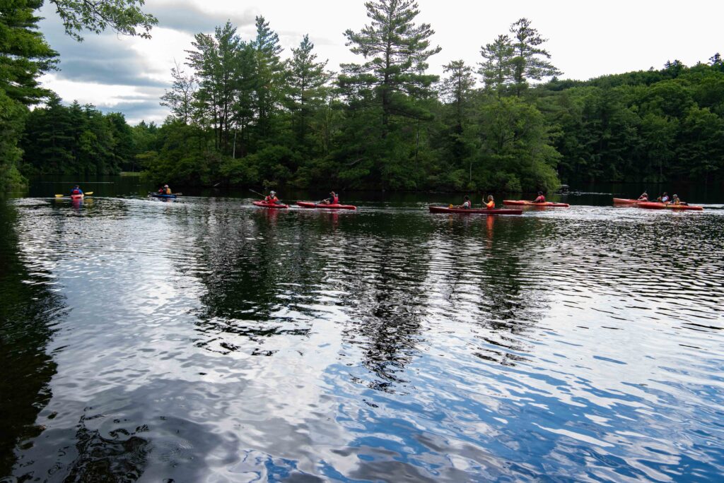 view of kayaks and pond